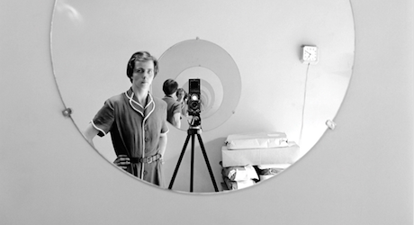 Vivan Maier photographs herself in a mirror